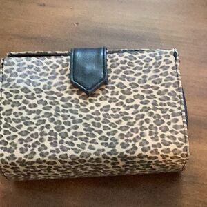 New! With tag Use as a clutch or a crossbody. Vegan leather animal print & black